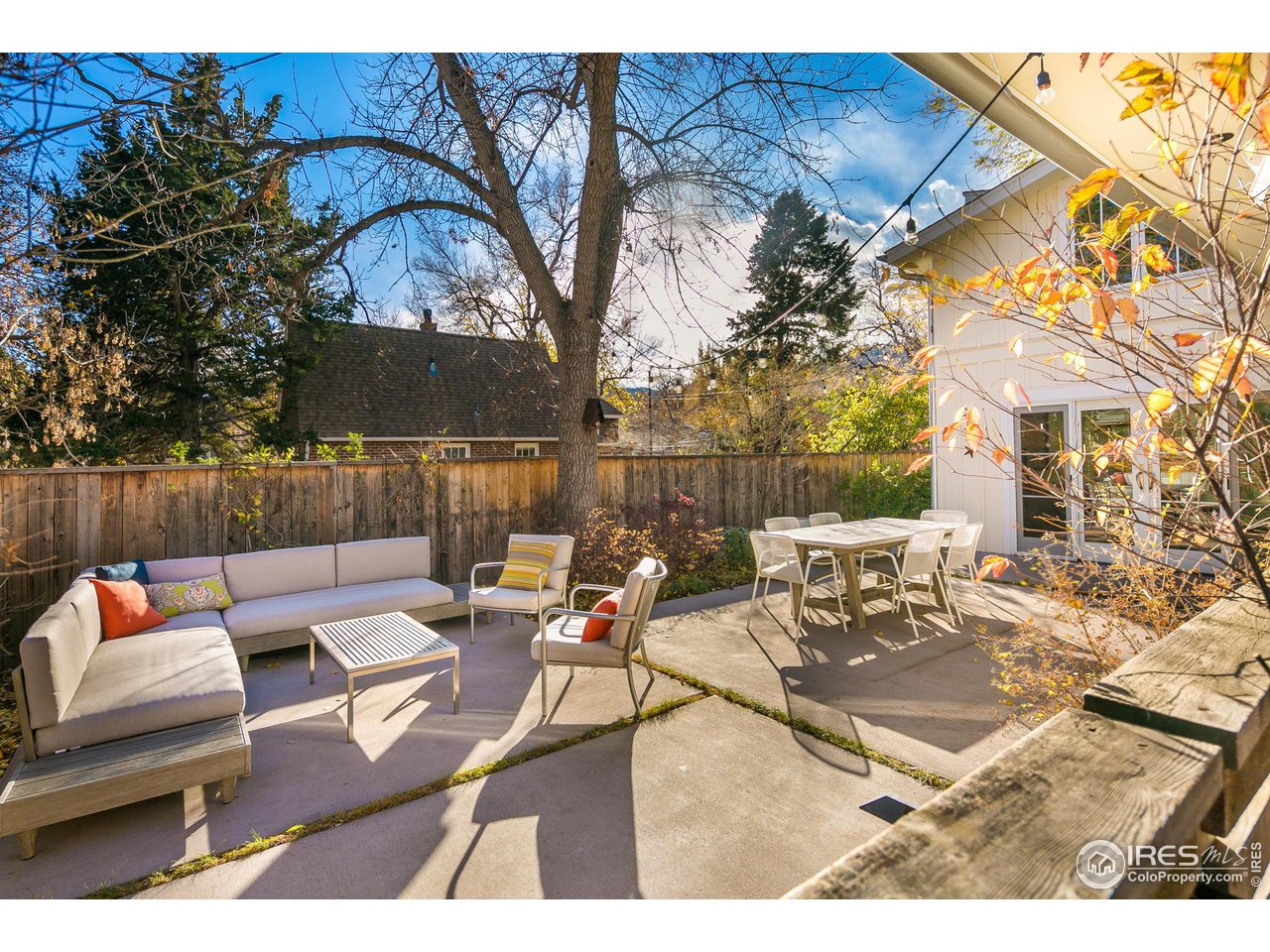 3221 8th Street Boulder, CO 80304 - Photo 39 of 40 a backyard of a house with table and chairs