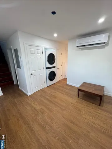 a room with a bed and a dresser