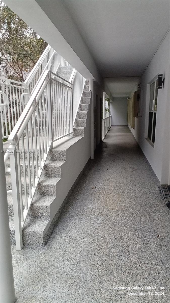 9248 Collins Avenue, Unit 105 Surfside, FL 33154 - Photo 5 of 16 Walkway to Unit