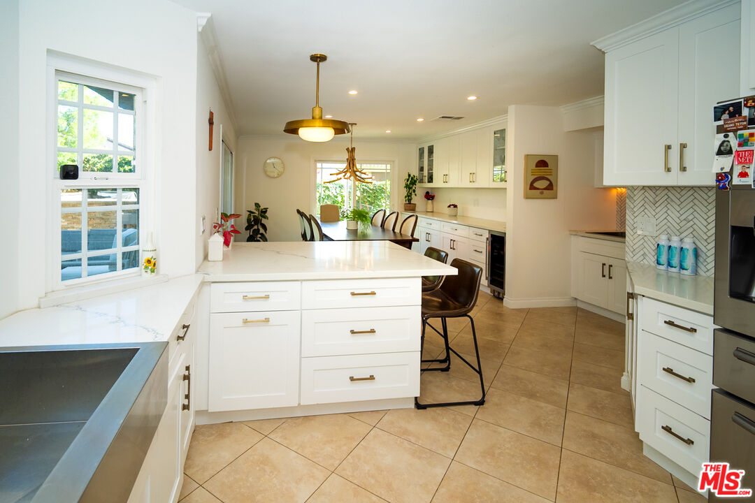 879 Shadowgrove Street Brea, CA 92821 - Photo 11 of 37 a kitchen with a stove a refrigerator and cabinets