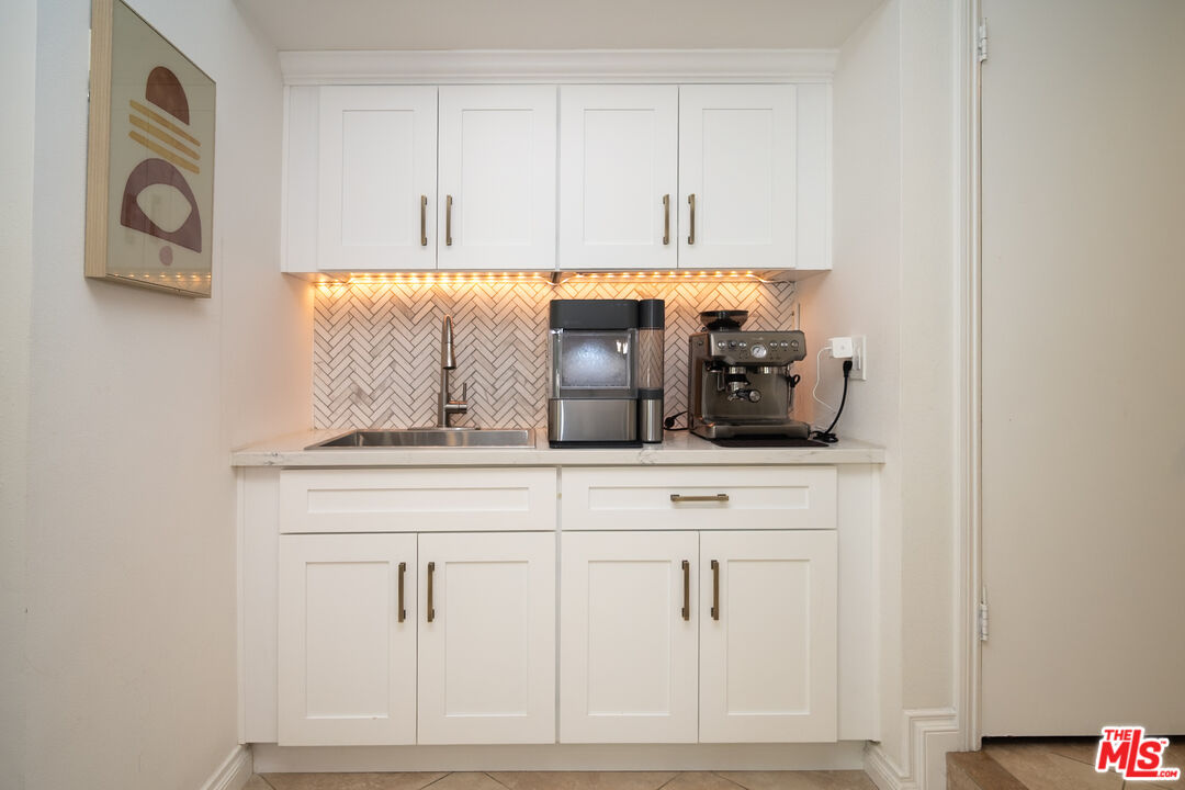 879 Shadowgrove Street Brea, CA 92821 - Photo 14 of 37 a kitchen with a sink and cabinets