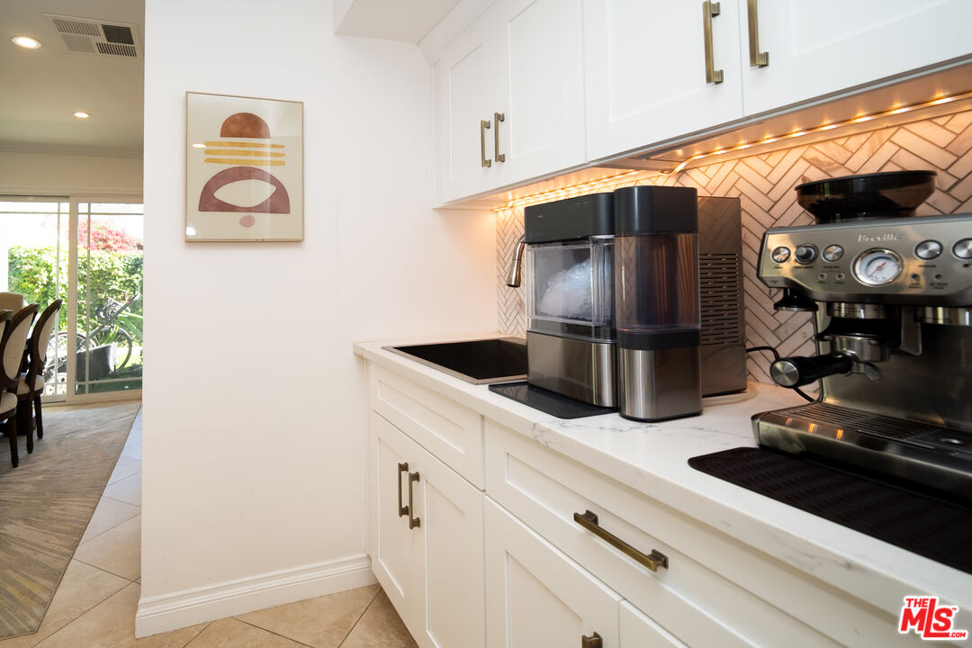 879 Shadowgrove Street Brea, CA 92821 - Photo 15 of 37 a kitchen with stainless steel appliances granite countertop a sink and a refrigerator