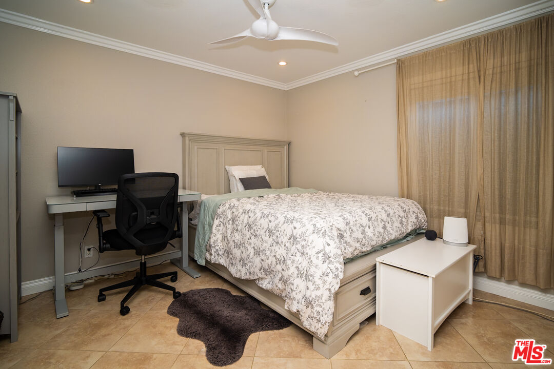 879 Shadowgrove Street Brea, CA 92821 - Photo 17 of 37 a bedroom with a bed and a chair in it