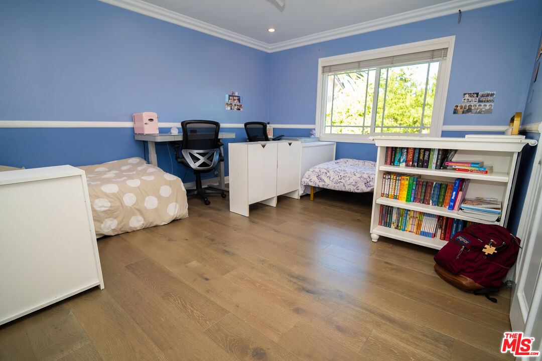 879 Shadowgrove Street Brea, CA 92821 - Photo 24 of 37 a living room with furniture and a book shelf