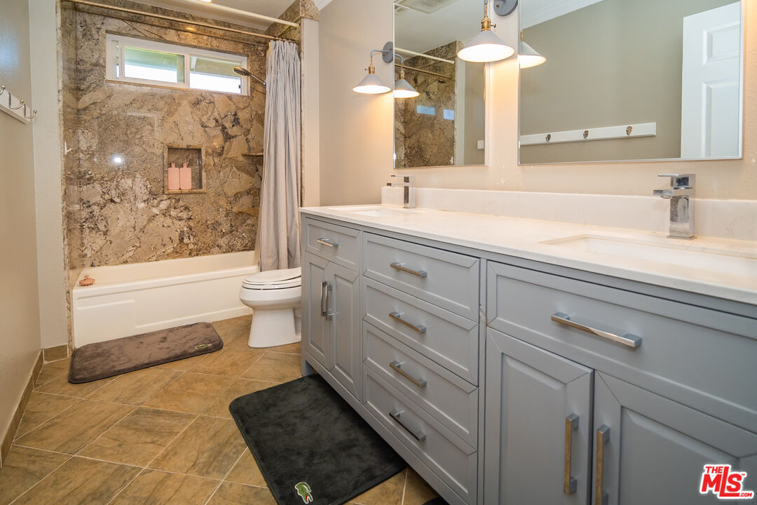 879 Shadowgrove Street Brea, CA 92821 - Photo 25 of 37 a bathroom with a sink a toilet and shower