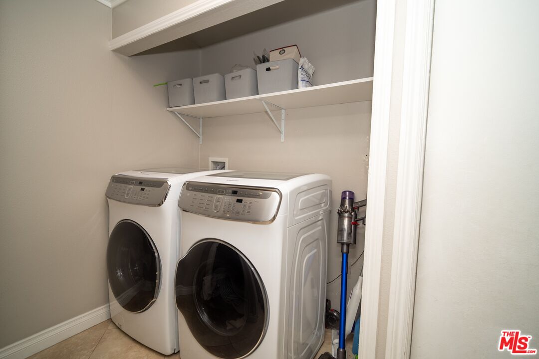 879 Shadowgrove Street Brea, CA 92821 - Photo 27 of 37 a utility room with dryer and washer