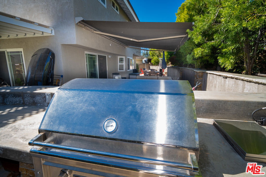 879 Shadowgrove Street Brea, CA 92821 - Photo 29 of 37 a view of a kitchen with stainless steel appliances granite countertop a stove top oven