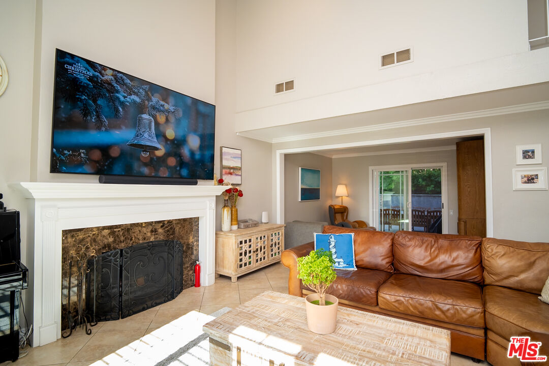 879 Shadowgrove Street Brea, CA 92821 - Photo 3 of 37 a living room with furniture and a fireplace