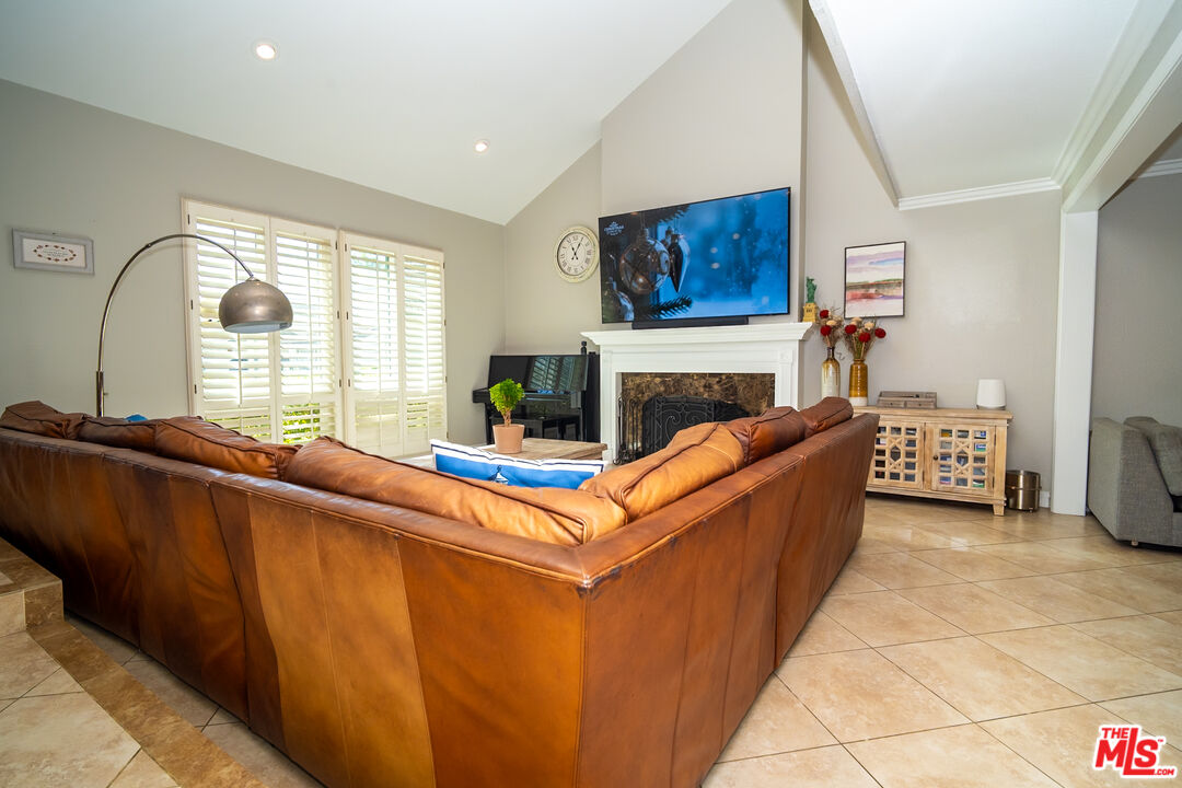 879 Shadowgrove Street Brea, CA 92821 - Photo 4 of 37 a living room with furniture and a fireplace