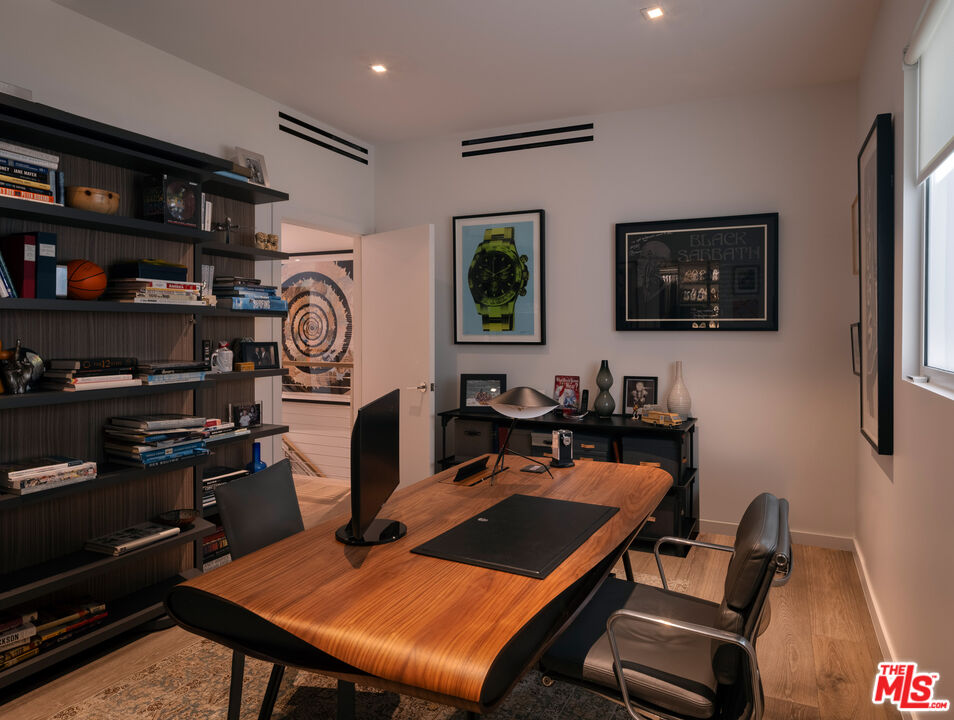 9000 West 3rd Street, Unit 103 Los Angeles, CA 90048 - Photo 12 of 27 a living room with furniture a rug and a flat screen tv