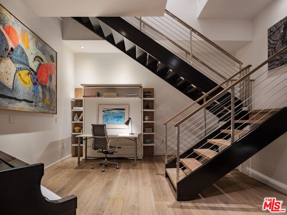 9000 West 3rd Street, Unit 103 Los Angeles, CA 90048 - Photo 16 of 27 a living room with furniture