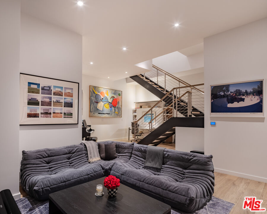 9000 West 3rd Street, Unit 103 Los Angeles, CA 90048 - Photo 17 of 27 a living room with furniture and a window