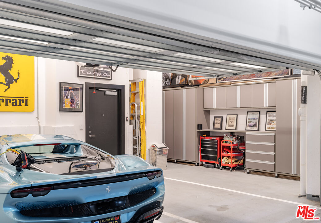 9000 West 3rd Street, Unit 103 Los Angeles, CA 90048 - Photo 20 of 27 a car parked in a garage