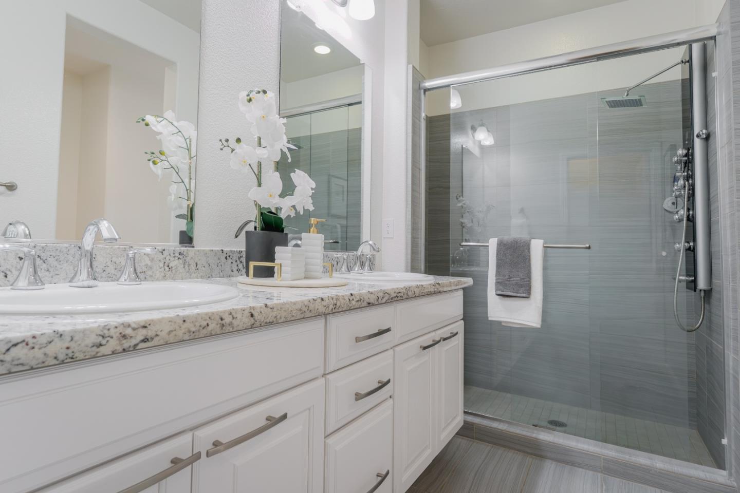 862 White Moonstone Loop San Jose, CA 95123 - Photo 34 of 54 a bathroom with a granite countertop sink a mirror and shower