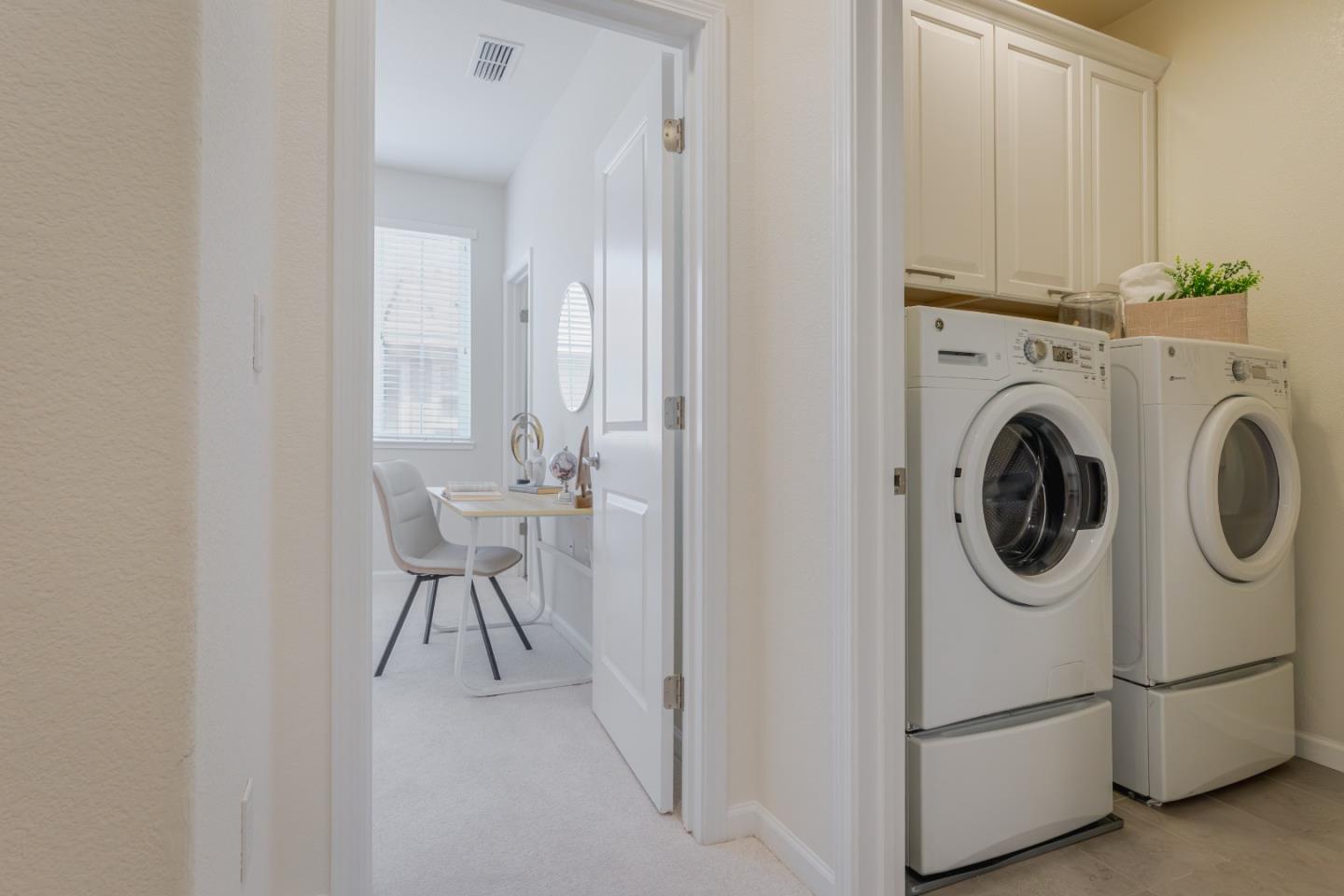 862 White Moonstone Loop San Jose, CA 95123 - Photo 36 of 54 a utility room with dryer washer and a view of living area