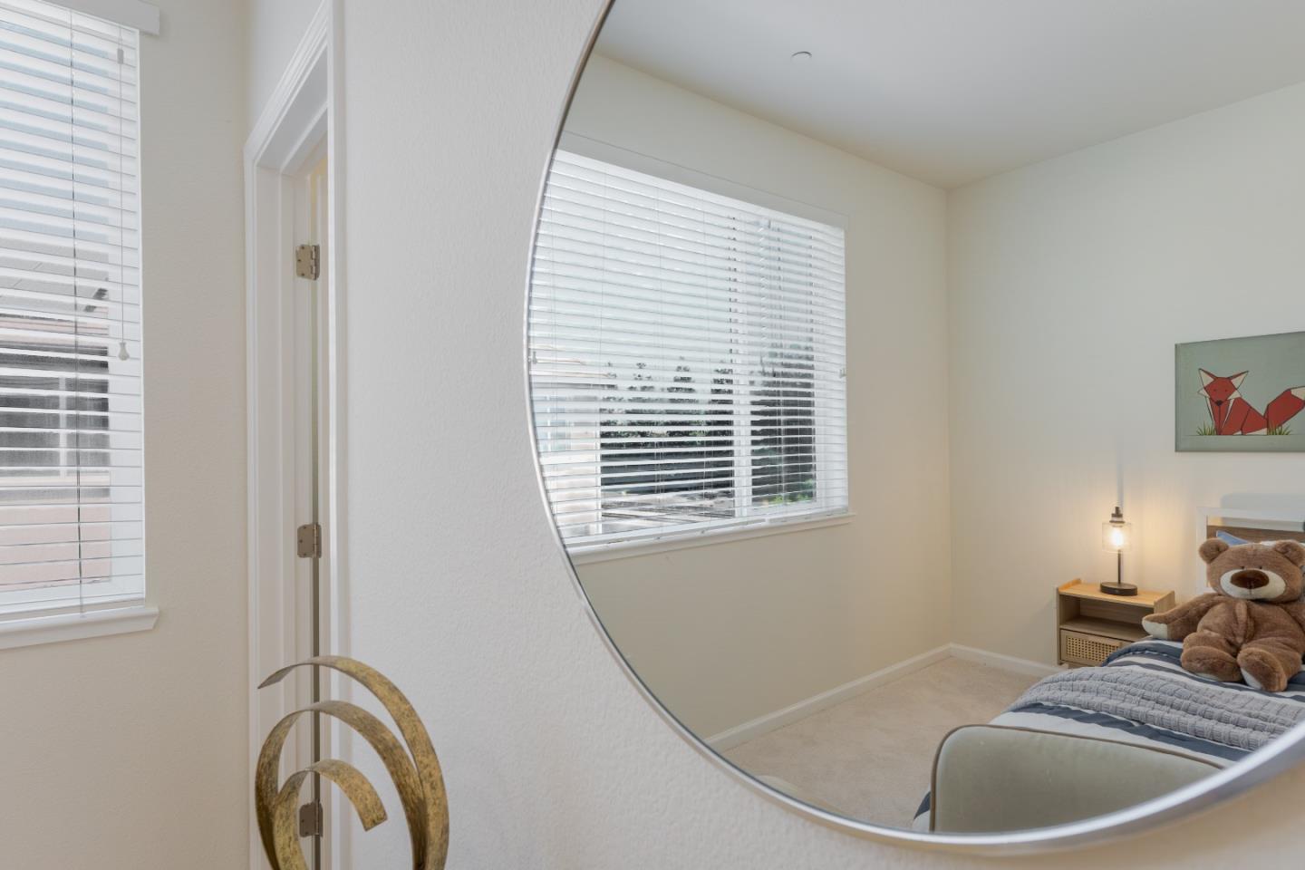 862 White Moonstone Loop San Jose, CA 95123 - Photo 40 of 54 a bathroom with a sink and a mirror