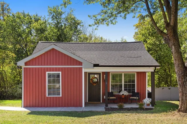 front view of a house with a yard