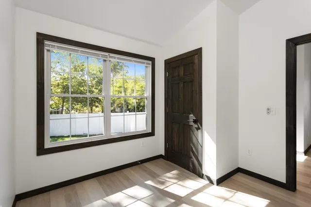 a view of a room that has a large window