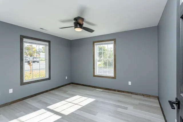 a view of an empty room with a window