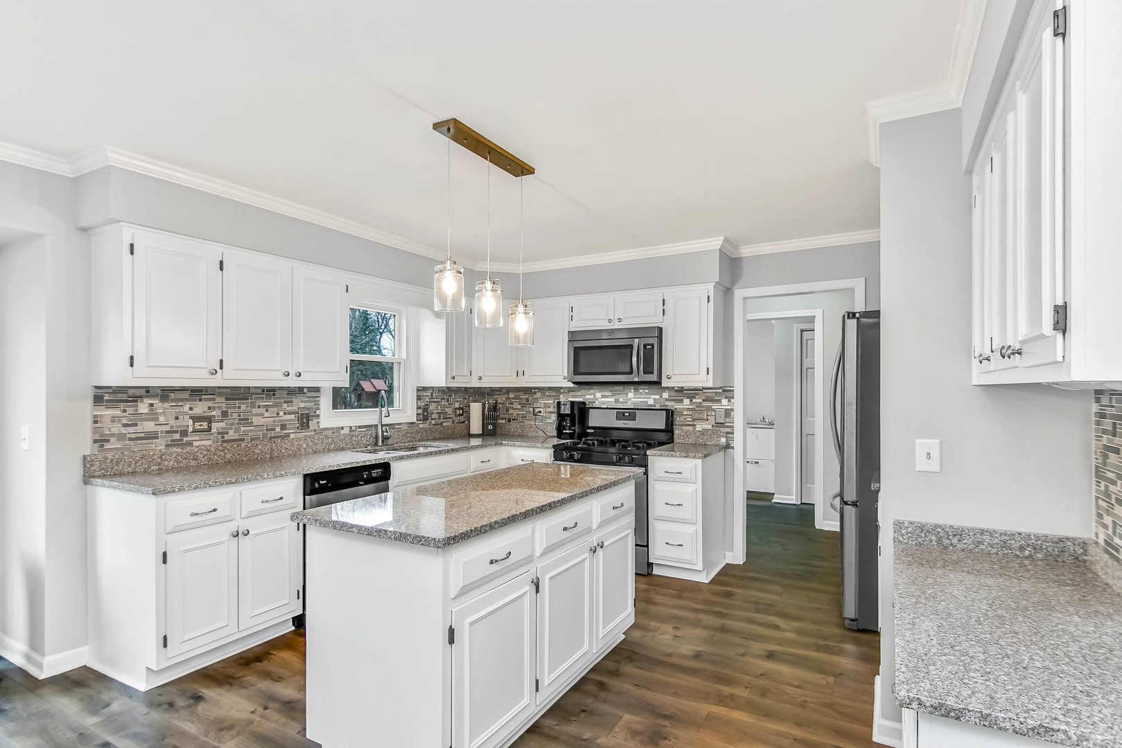 409 Delaware Circle Bolingbrook, IL 60440 - Photo 2 of 29 a kitchen with a sink stove and refrigerator