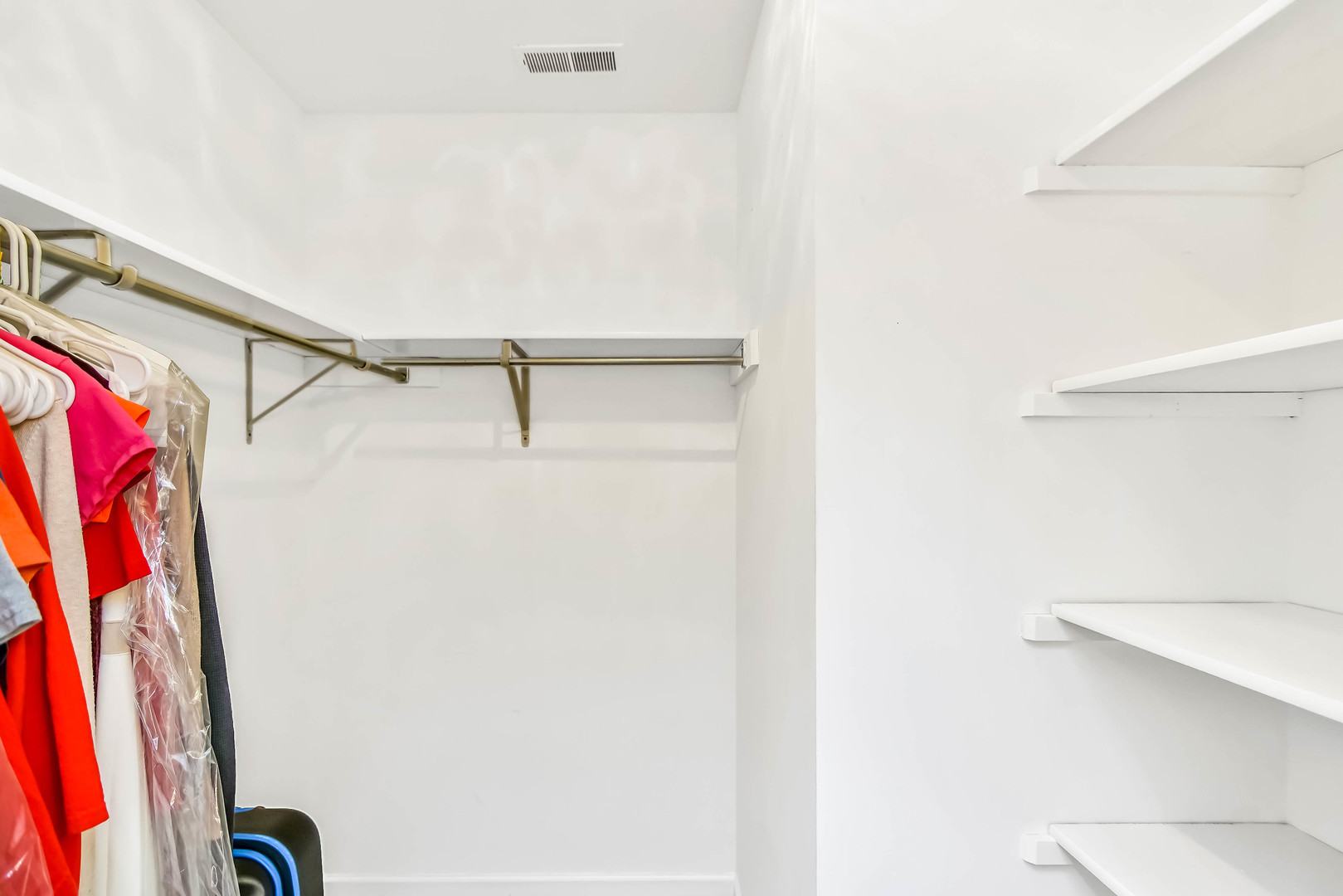 409 Delaware Circle Bolingbrook, IL 60440 - Photo 15 of 29 a view of walk in closet with clothes and shoes