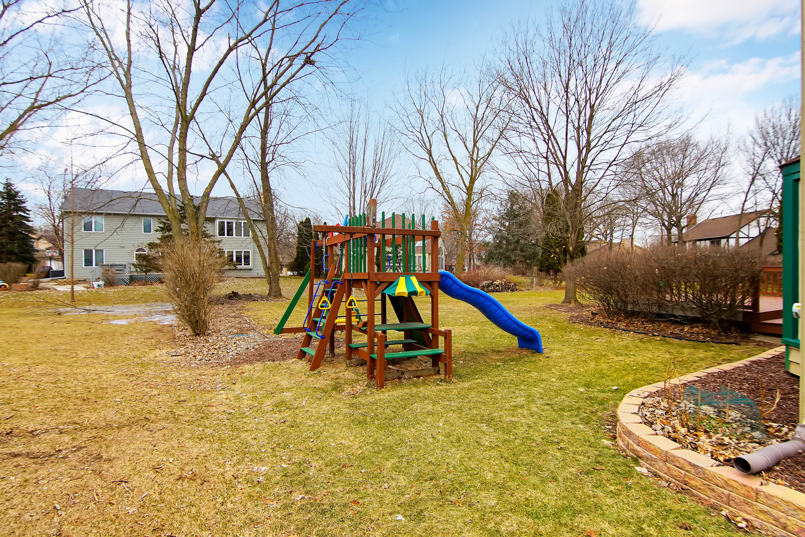 409 Delaware Circle Bolingbrook, IL 60440 - Photo 24 of 29 a view of a playground with a slide and swing