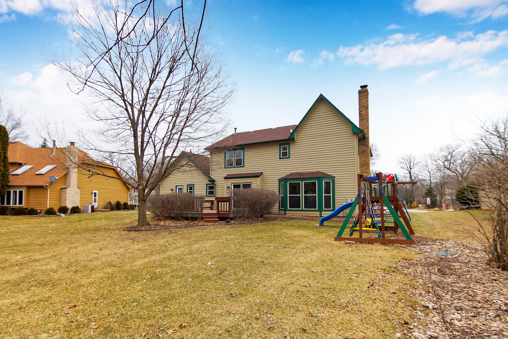 409 Delaware Circle Bolingbrook, IL 60440 - Photo 25 of 29 a view of a house with a yard and a large tree