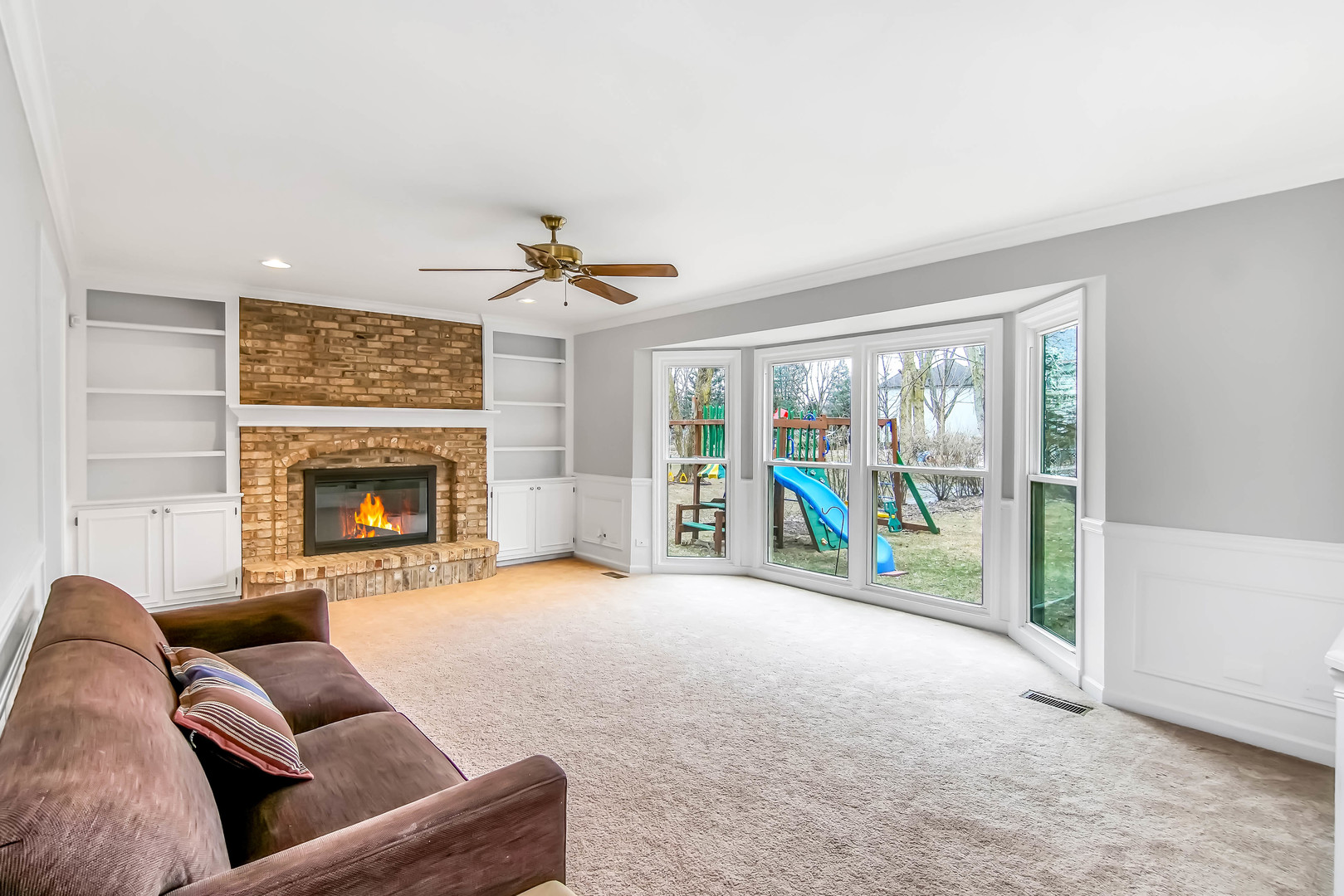 409 Delaware Circle Bolingbrook, IL 60440 - Photo 7 of 29 a living room with furniture and a fireplace