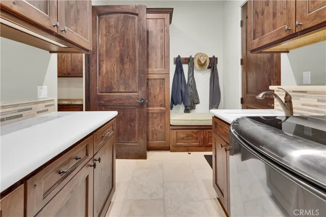 a view of a chairs and table in the balcony