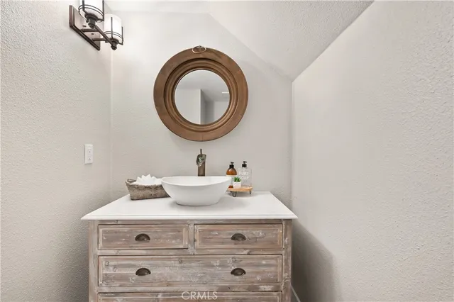 a bathroom with double sink and a mirror