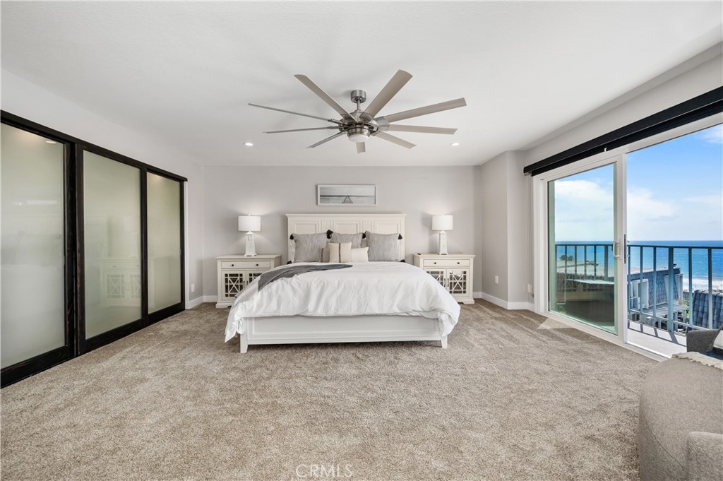 25872 Vista Drive West Dana Point, CA 92624 - Photo 25 of 75 a spacious bedroom with a bed and a large window