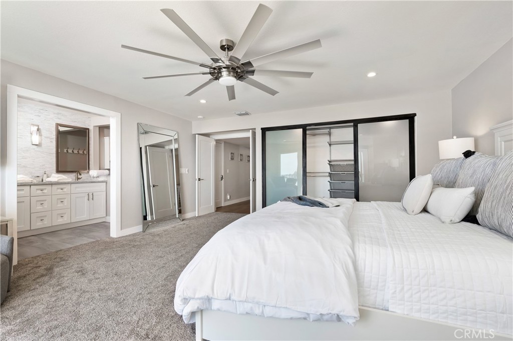 25872 Vista Drive West Dana Point, CA 92624 - Photo 26 of 75 a bedroom with a large bed and chandelier