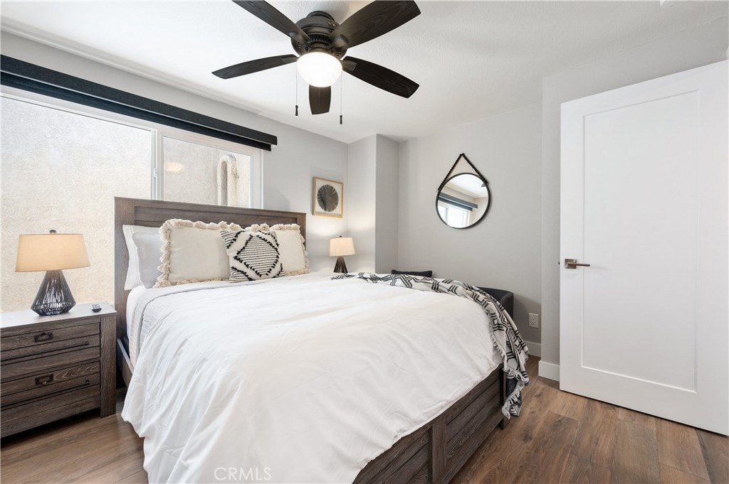 25872 Vista Drive West Dana Point, CA 92624 - Photo 41 of 75 a bedroom with a bed and wooden floor