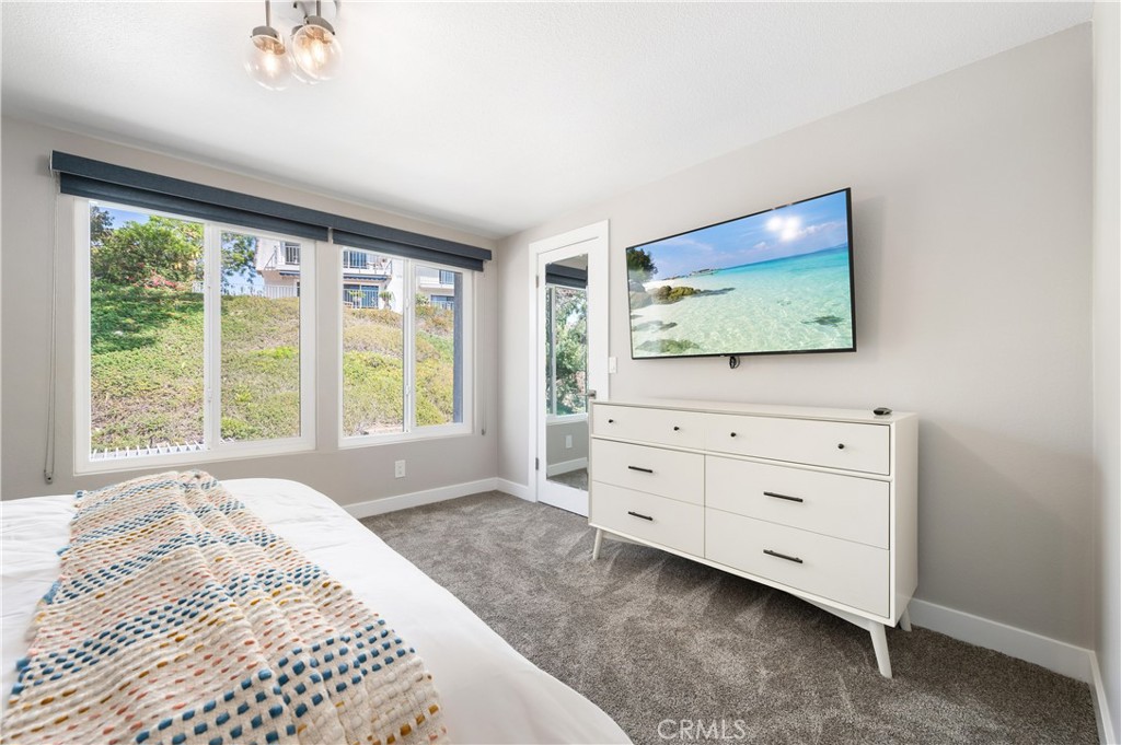 25872 Vista Drive West Dana Point, CA 92624 - Photo 46 of 75 a bedroom with a bed and a flat screen tv
