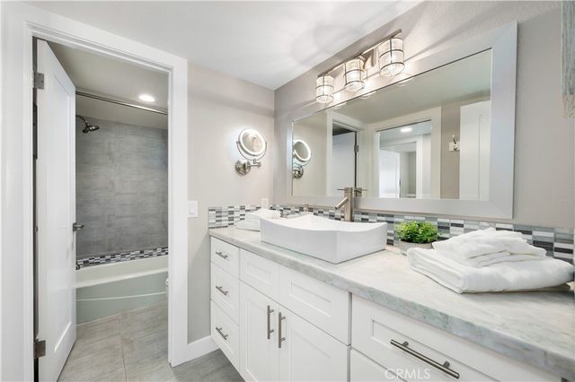 an aerial view of a house with a ocean view