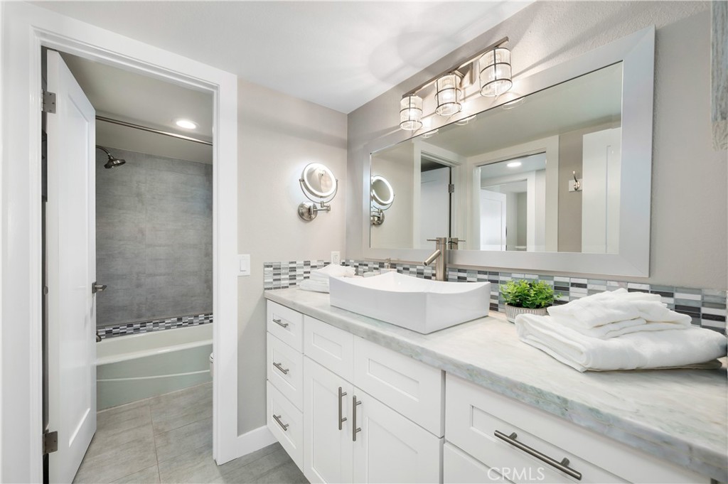25872 Vista Drive West Dana Point, CA 92624 - Photo 47 of 75 a bathroom with a granite countertop sink and a mirror
