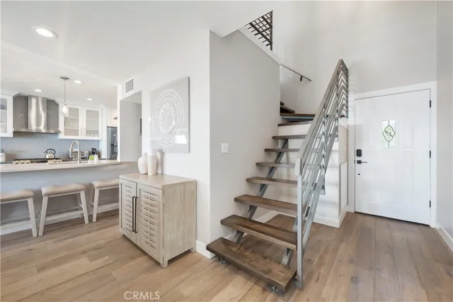 a living room with furniture and kitchen view