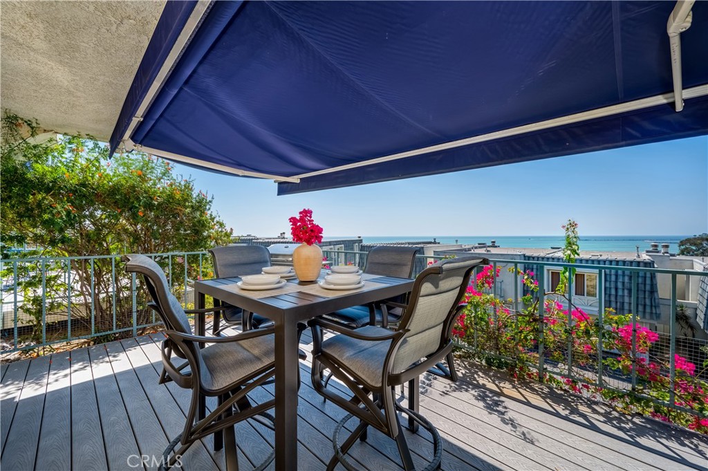 25872 Vista Drive West Dana Point, CA 92624 - Photo 57 of 75 a view of a dining table and chairs in patio with potted plants