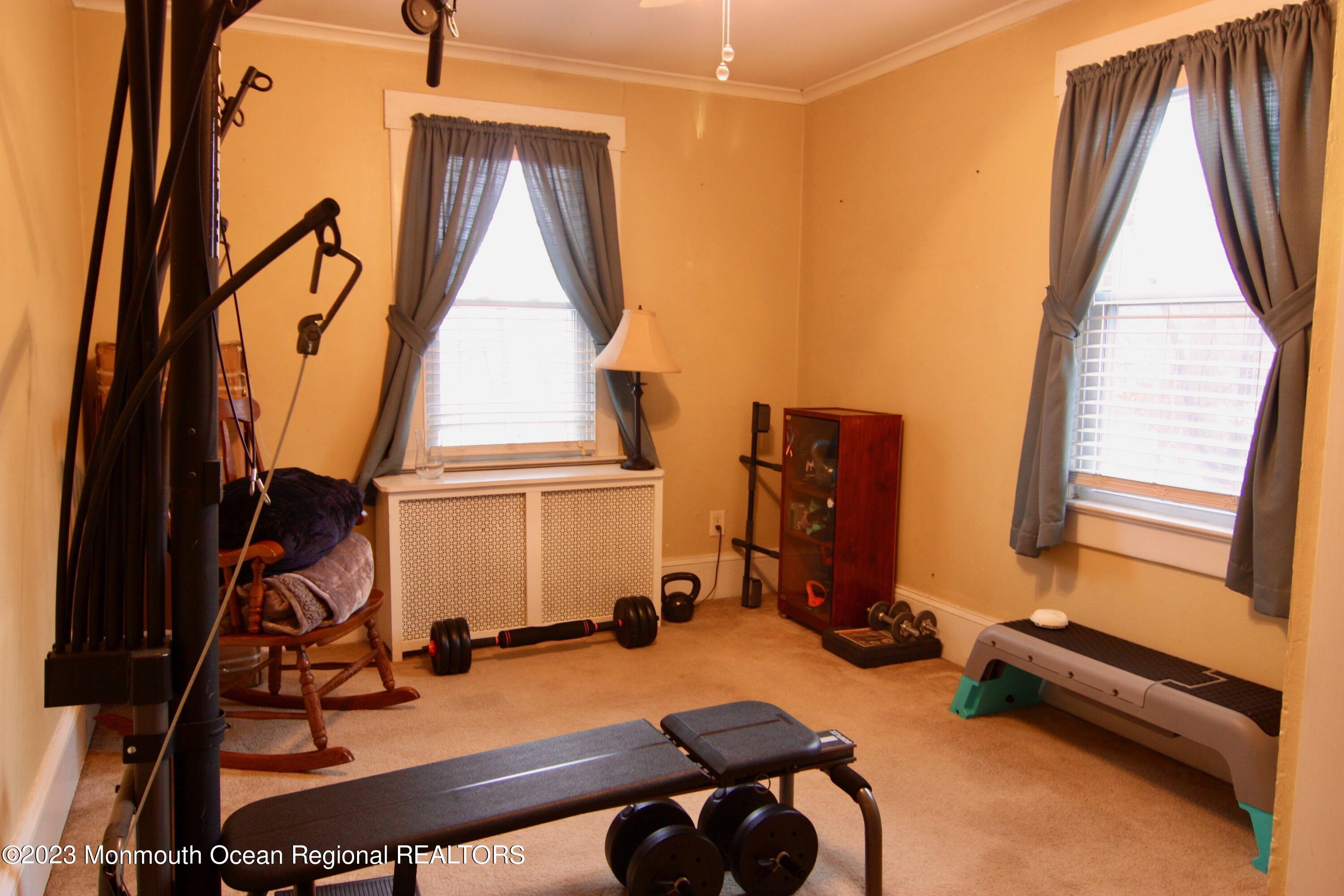 62 Church Road Howell, NJ 07731 - Photo 20 of 23 a room with furniture and gym equipment