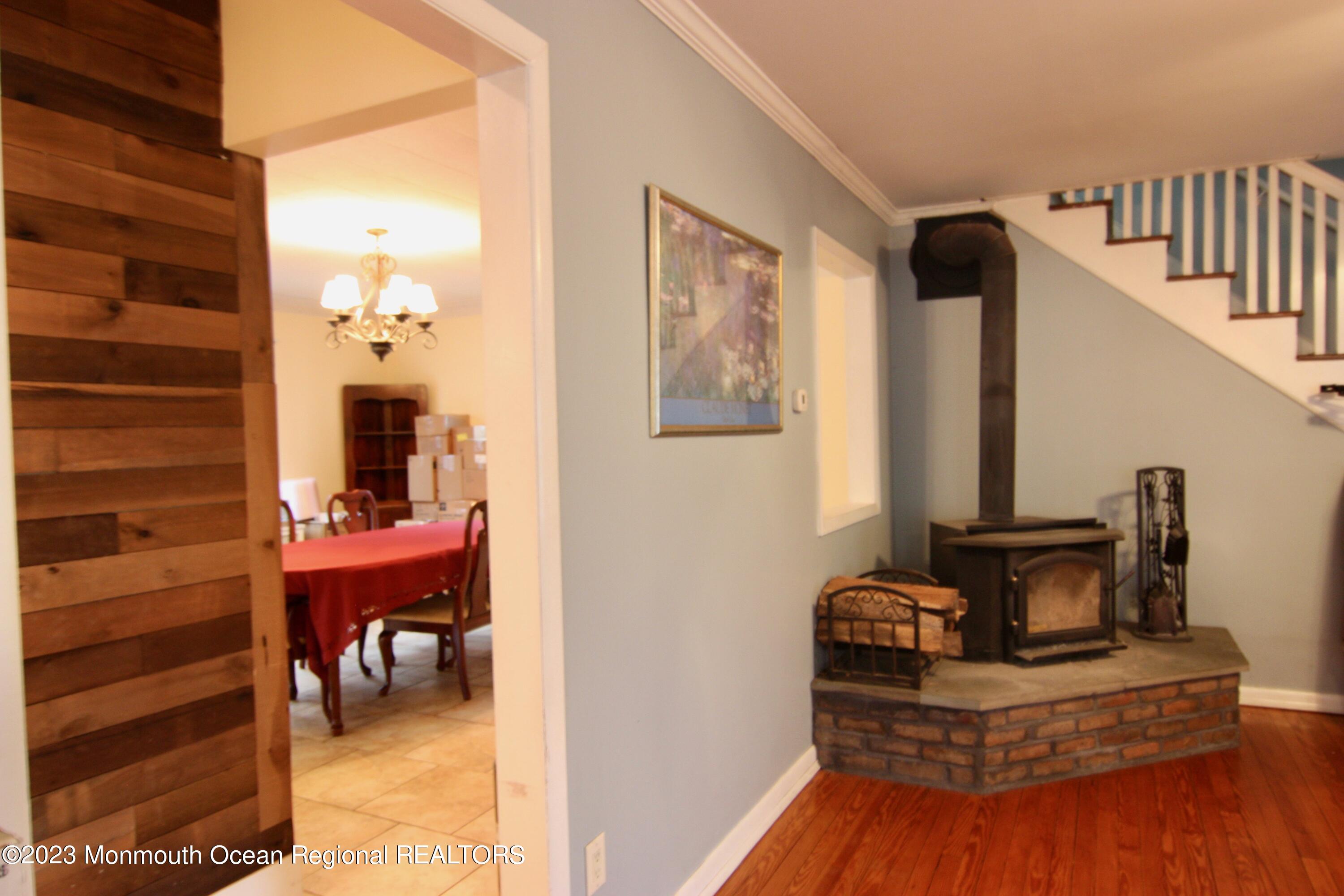 62 Church Road Howell, NJ 07731 - Photo 22 of 23 a view of a hallway to a livingroom with furniture and windows