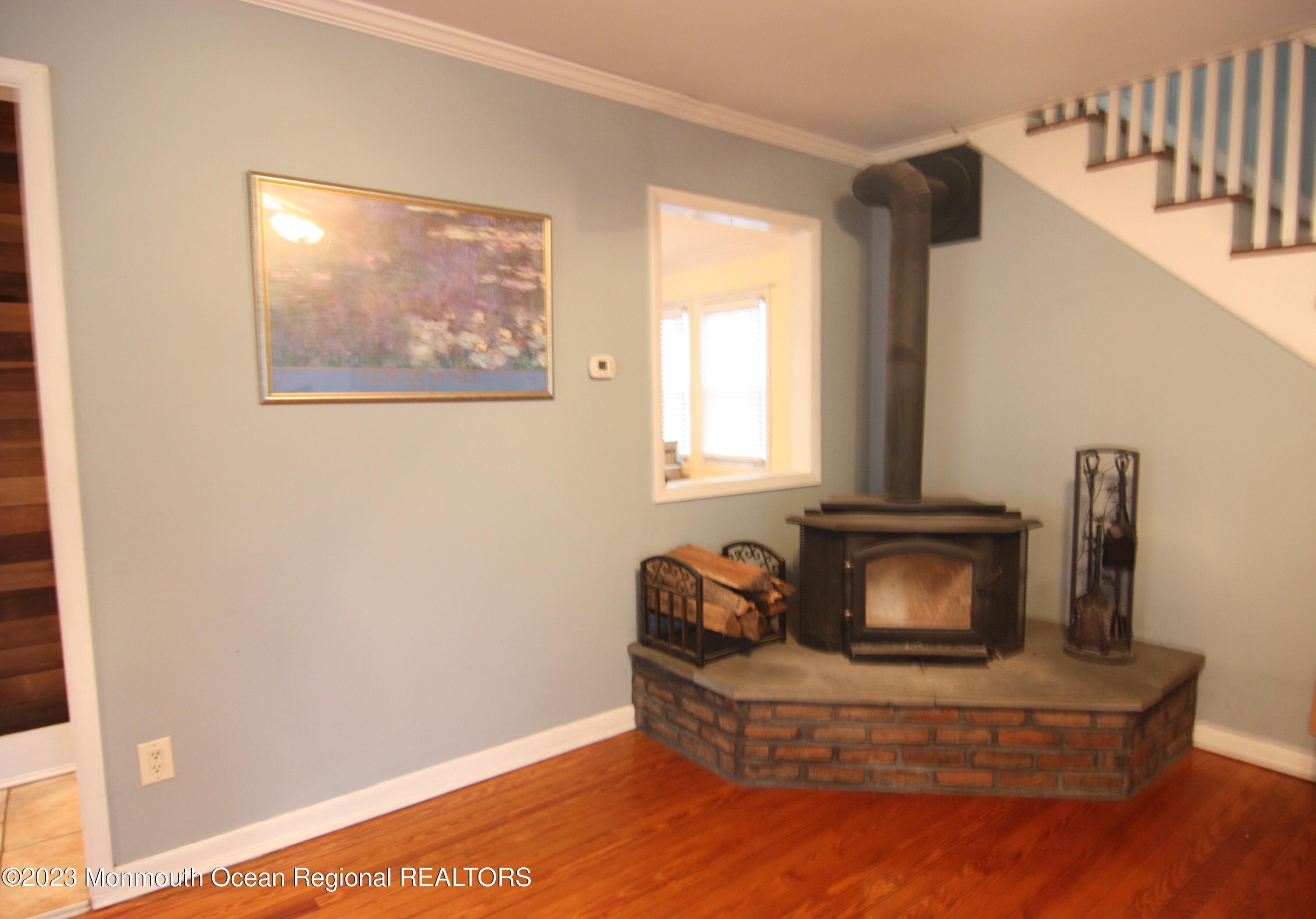 62 Church Road Howell, NJ 07731 - Photo 4 of 23 a living room with furniture and a fireplace