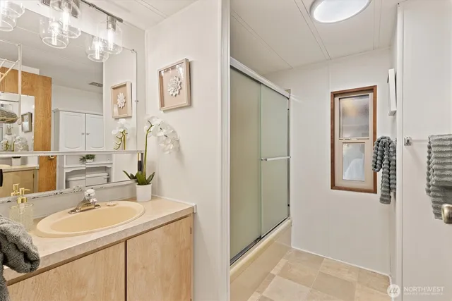 a bathroom with a sink and a mirror