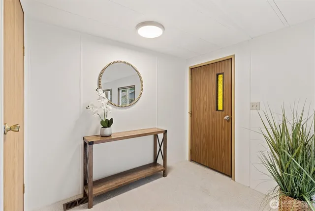 a room with a door and a mirror