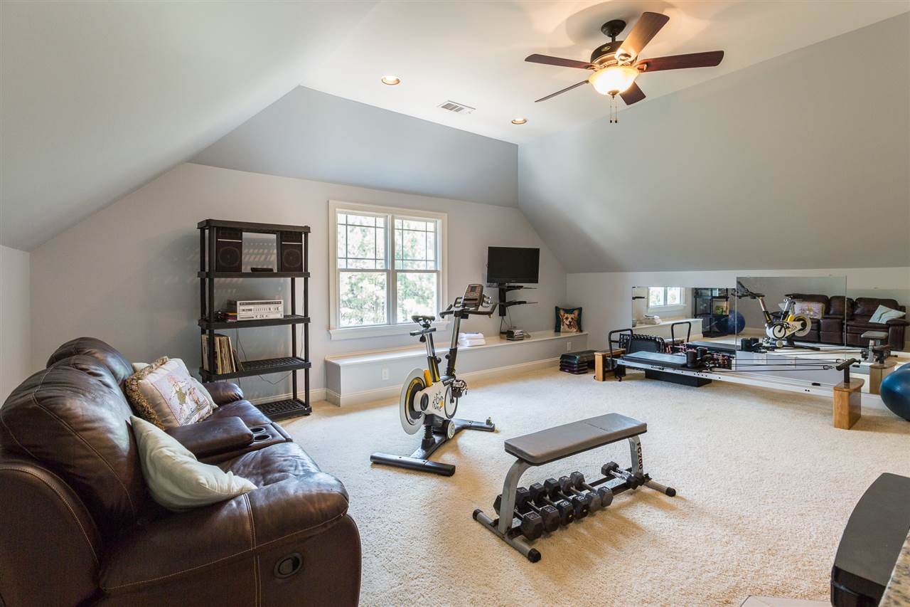 1716 Stannard Trail Raleigh, NC 27612 - Photo 23 of 30 This wonderful space offers a built-in wet bar, ceiling fan, built in wall bench and recessed lighting. Perfect for game room, exercise room, au pair suite or teen suite. There is a large walk-in attic on the 3rd floor. Versatile 3rd Floor Rec Room