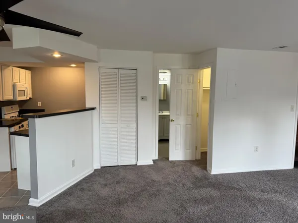 a view of a hallway with a bathroom