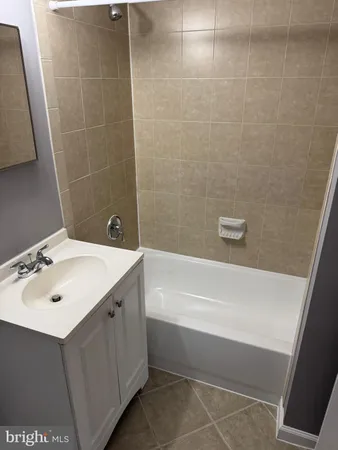 a bathroom with a sink and a bathtub