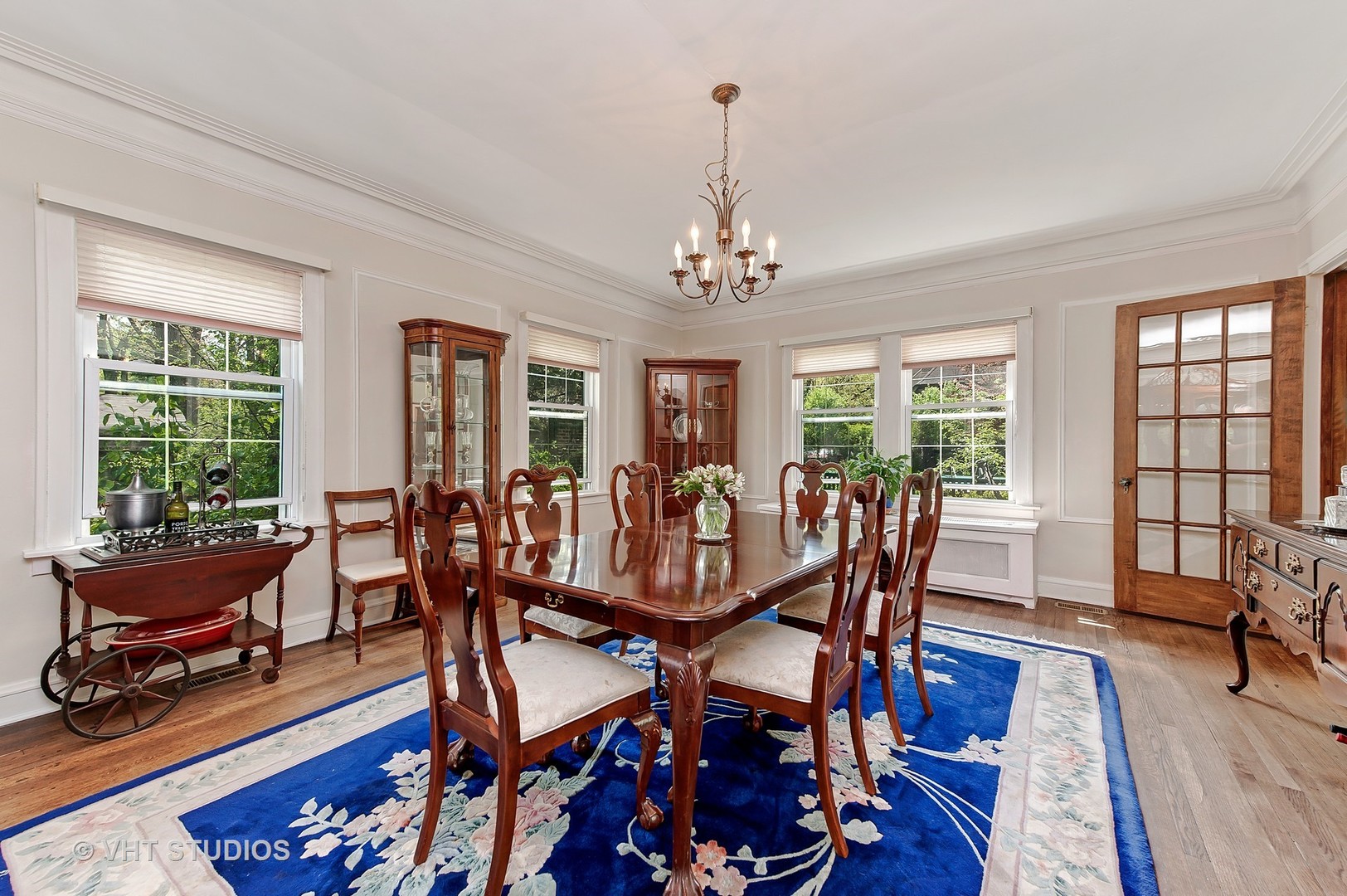 1206 Tower Road Winnetka, IL 60093 - Photo 6 of 19 a view of a dining room with furniture window and wooden floor