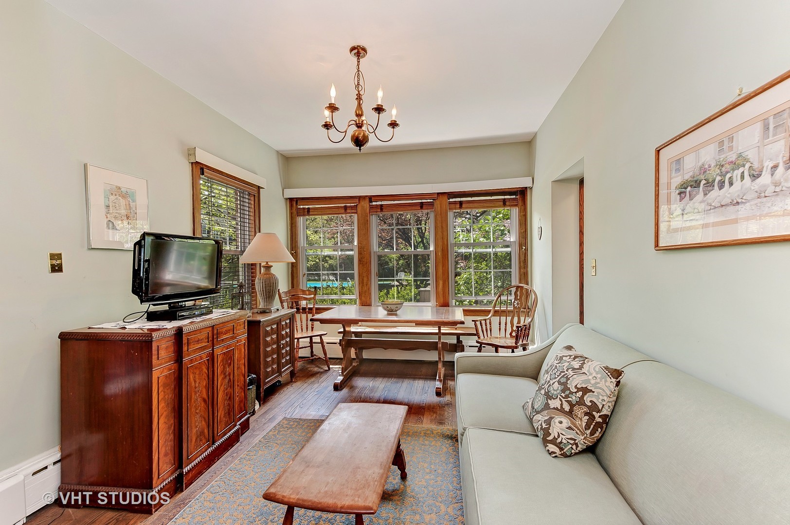 1206 Tower Road Winnetka, IL 60093 - Photo 7 of 19 a living room with furniture and a flat screen tv
