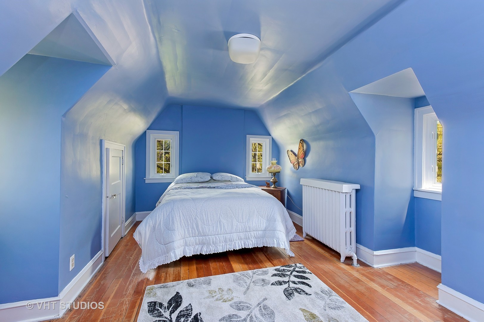 1206 Tower Road Winnetka, IL 60093 - Photo 10 of 19 a bedroom with a bed and a mirror