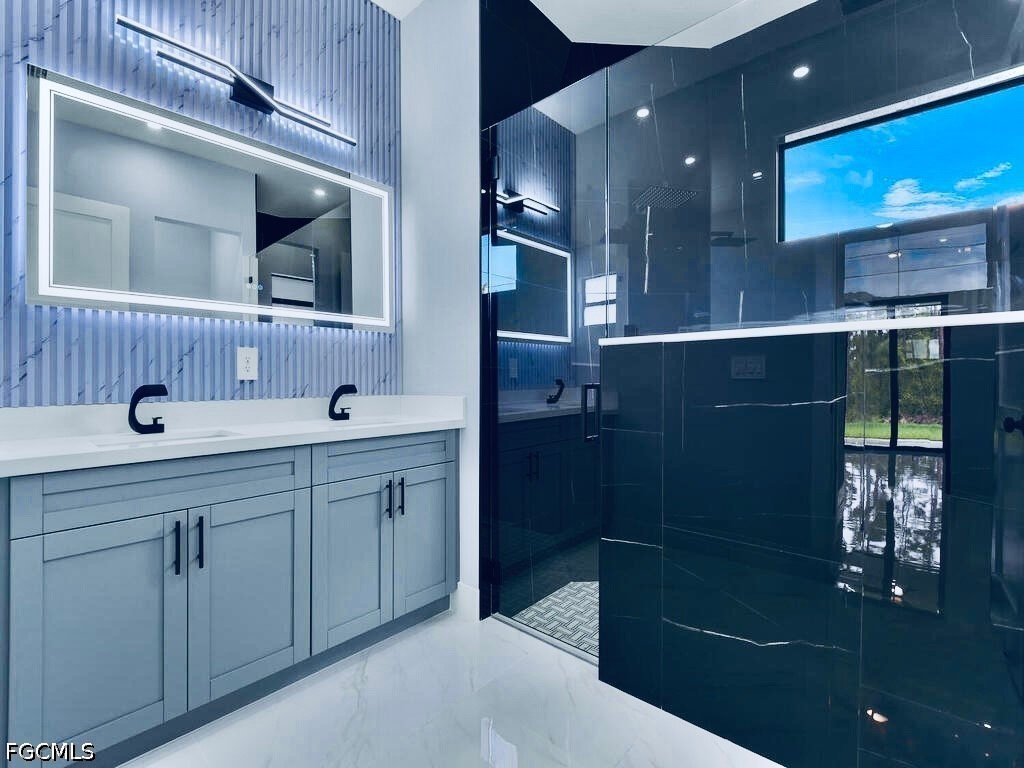 3517 2nd Street Southwest Lehigh Acres, FL 33976 - Photo 12 of 28 a bathroom with a sink a toilet and mirror